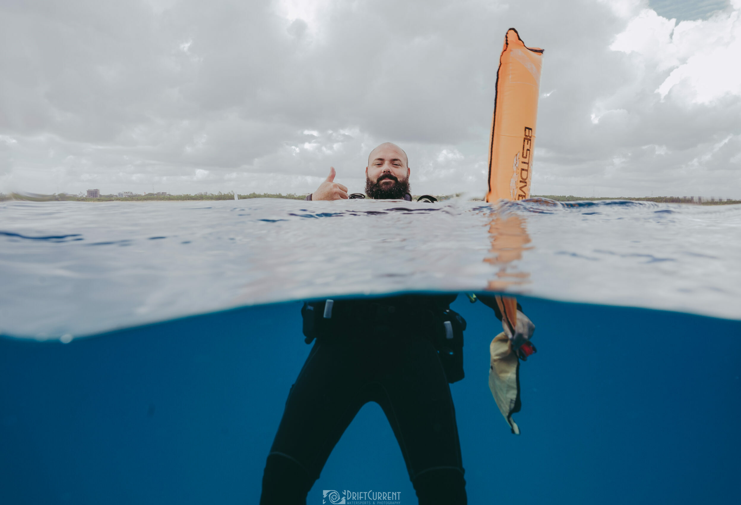 Diver giving a thumbs-up after emerging from a Triton Diving session in Playa del Carmen's waters