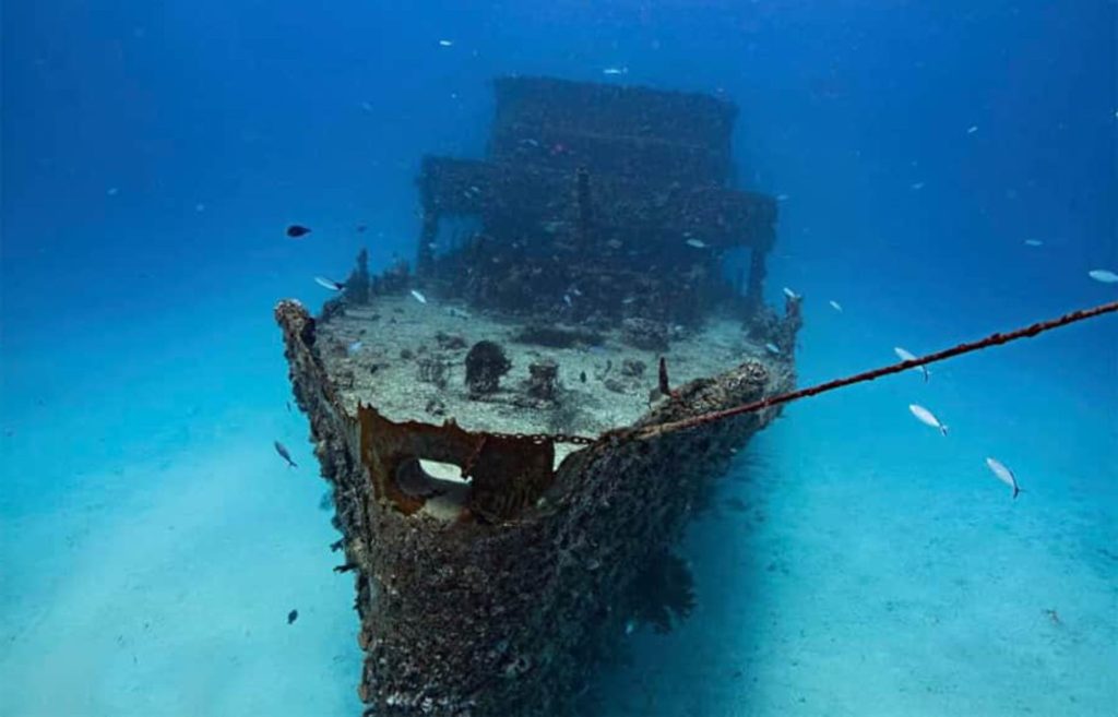 Sunken C-56 Juan Escutia wreck explored by 'Triton Diving' divers in the clear waters of Cozumel.